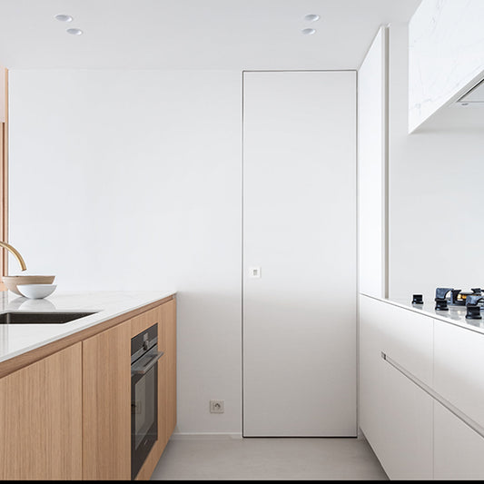 A white invisible frame door, also called dib door or hidden door.